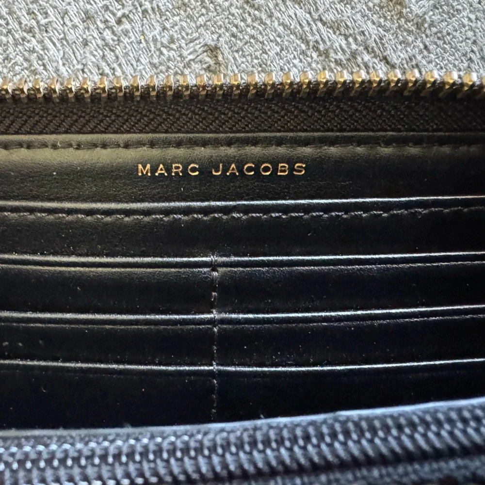 The Marc Jacobs Saffiano Leather Zip Around Continental Wallet - $195 MSRP